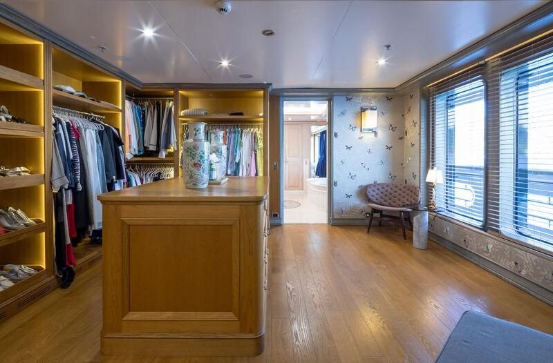 a room with a closet and a dresser aboard BOADICEA Yacht for Sale