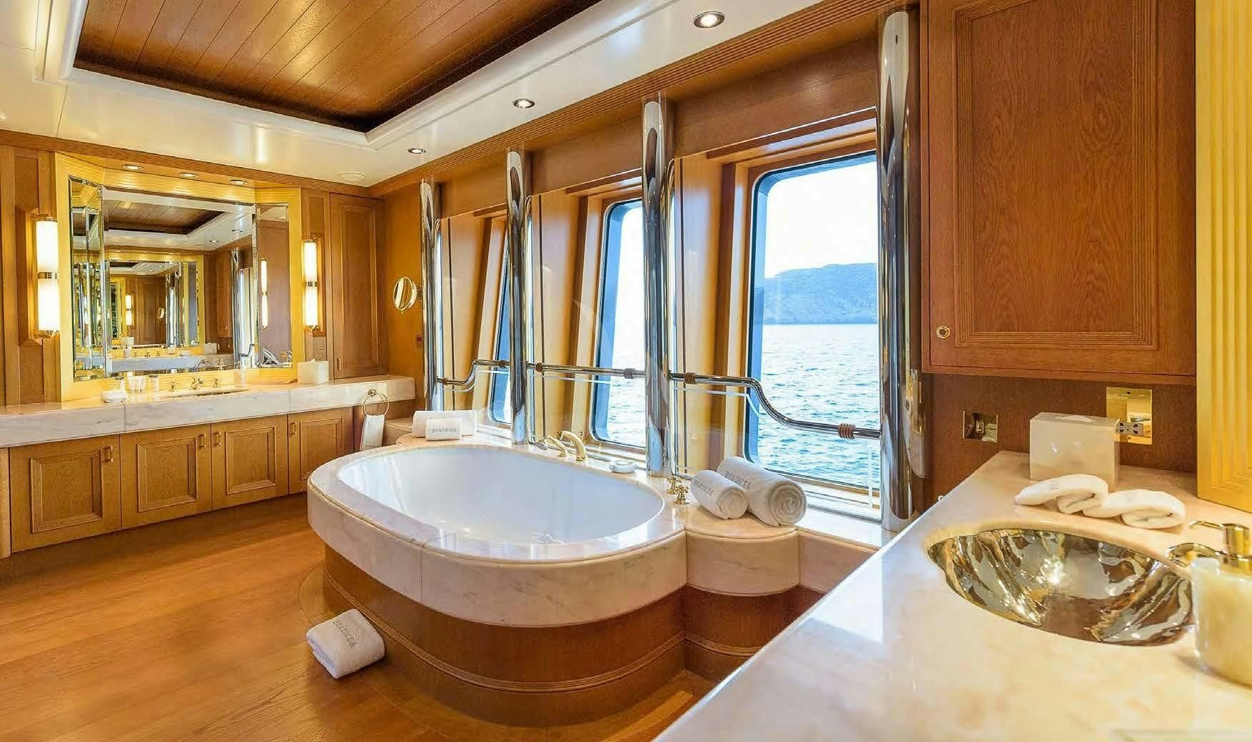 a bathroom with a large tub aboard BOADICEA Yacht for Sale