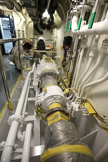 a group of people in a factory aboard BOADICEA Yacht for Sale