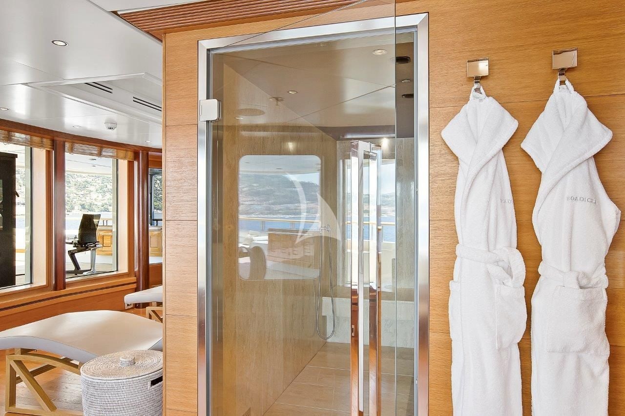 a room with a glass door aboard BOADICEA Yacht for Sale