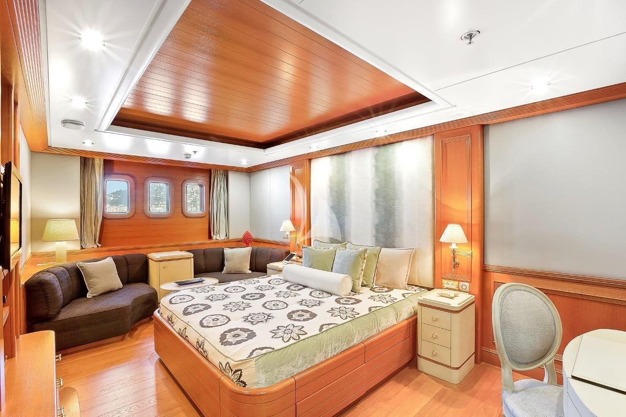 a large bedroom with a bed aboard BOADICEA Yacht for Sale