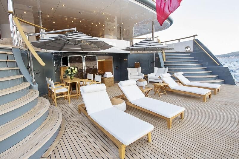 a boat with a table and chairs aboard BOADICEA Yacht for Sale