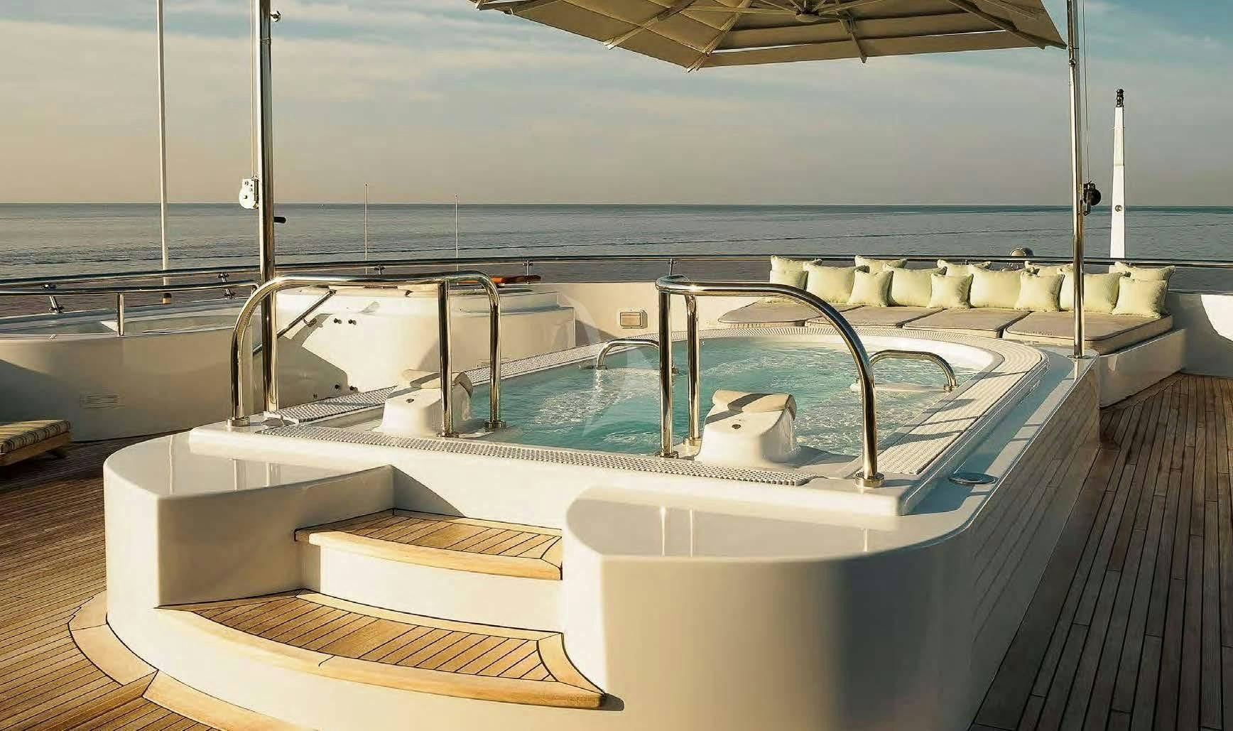 a large white boat on a deck aboard BOADICEA Yacht for Sale