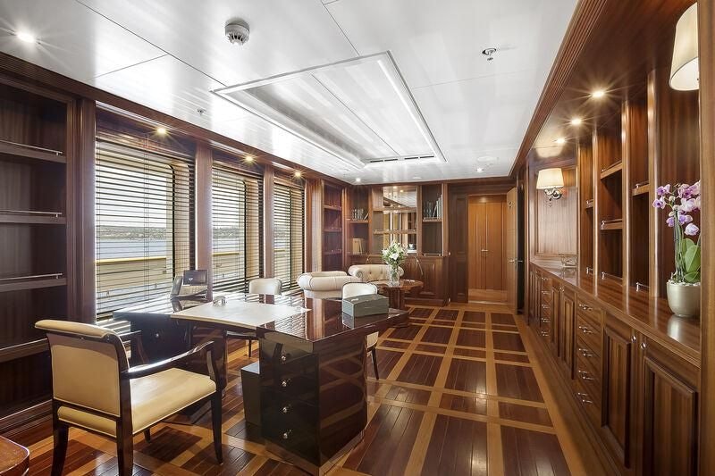 a large kitchen with a dining table aboard BOADICEA Yacht for Sale