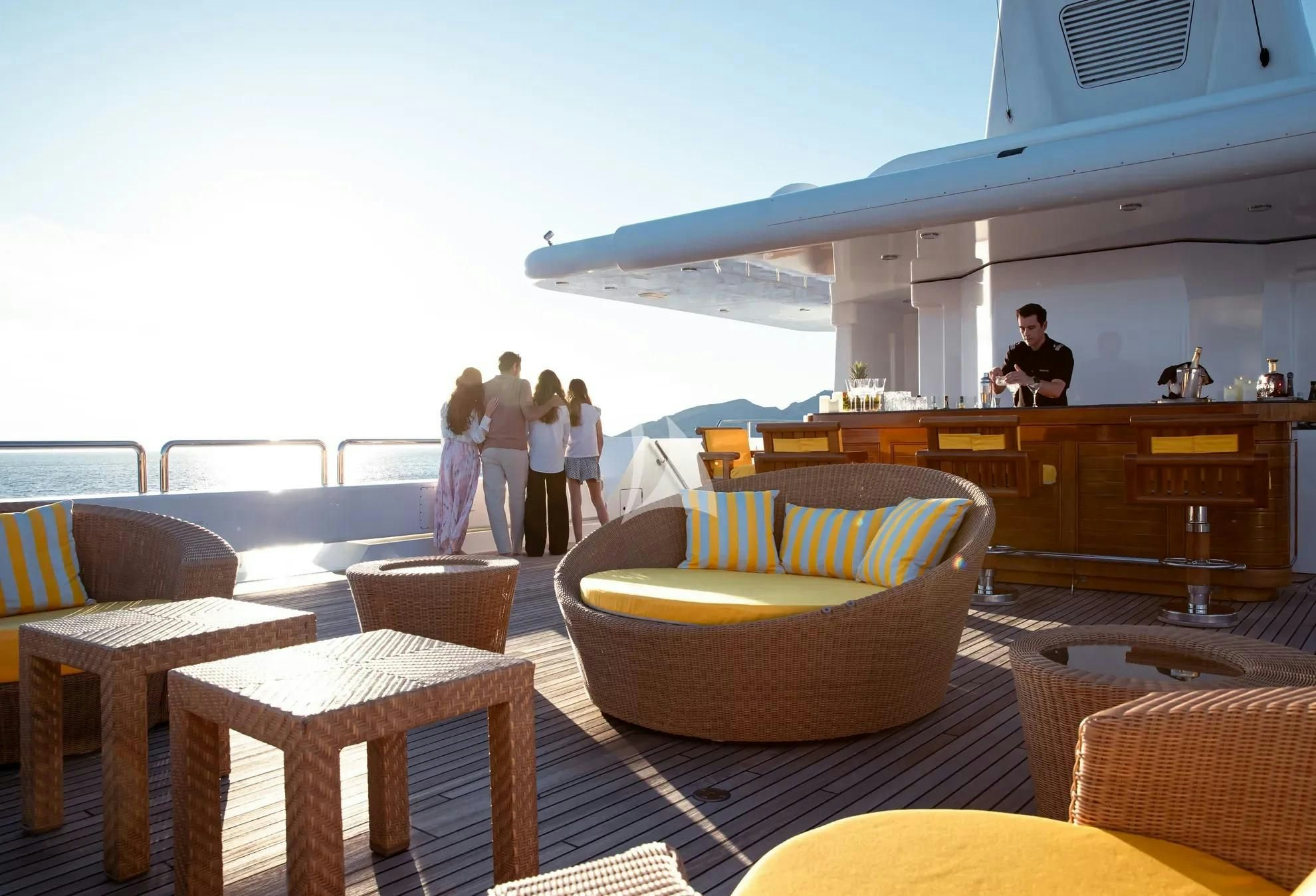 a group of people standing outside a building aboard BOADICEA Yacht for Sale
