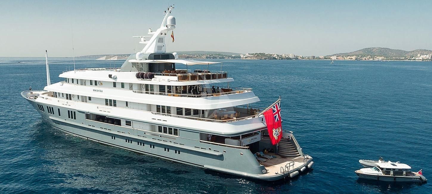 a large white ship in the water aboard BOADICEA Yacht for Sale