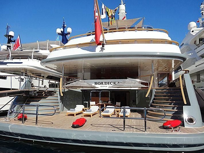 a large boat docked at a pier aboard BOADICEA Yacht for Sale