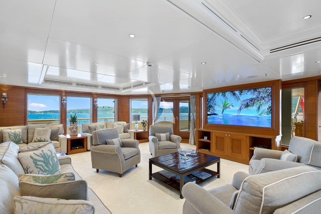 a living room with a large screen aboard BOADICEA Yacht for Sale
