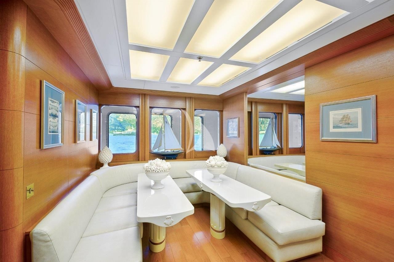 a room with a couch and a table aboard BOADICEA Yacht for Sale