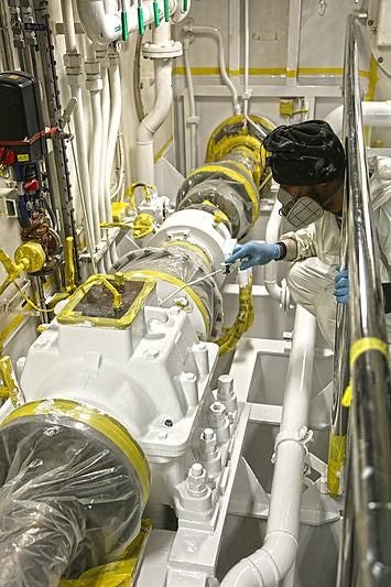 a person working in a factory aboard BOADICEA Yacht for Sale