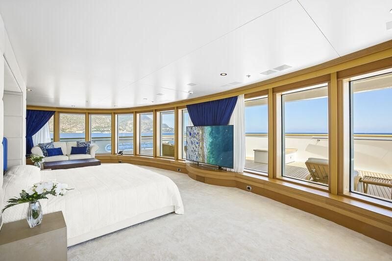 a room with a bed and a window aboard BOADICEA Yacht for Sale