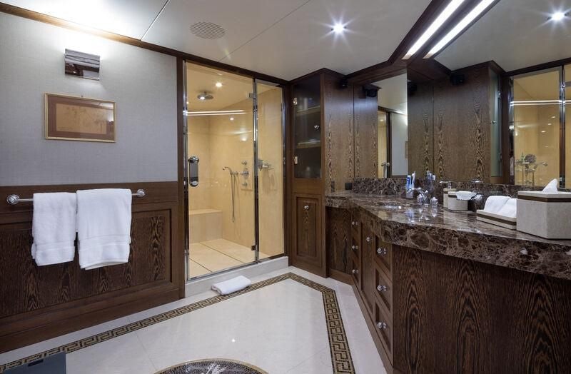 a bathroom with a large mirror aboard BOADICEA Yacht for Sale
