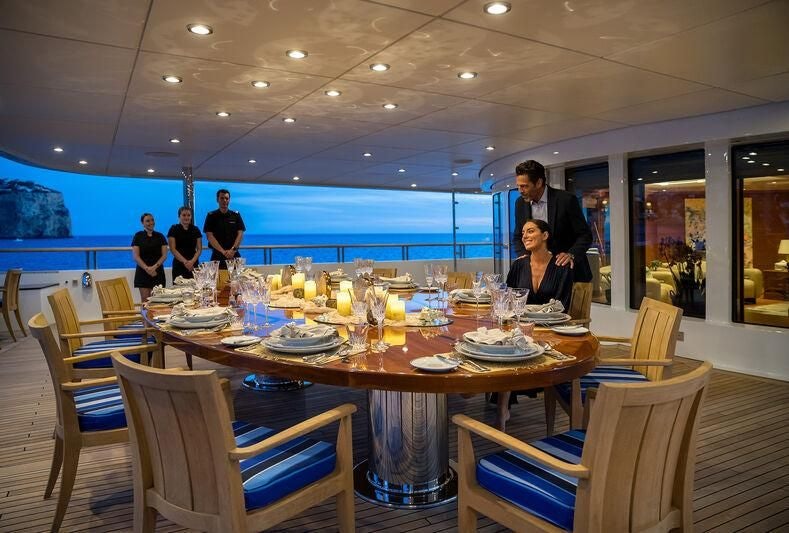 a table set with food and drinks aboard BOADICEA Yacht for Sale