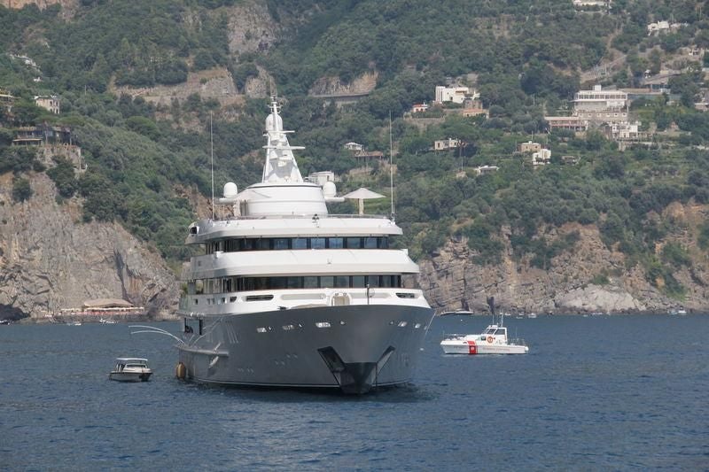 a large ship in the water aboard BOADICEA Yacht for Sale