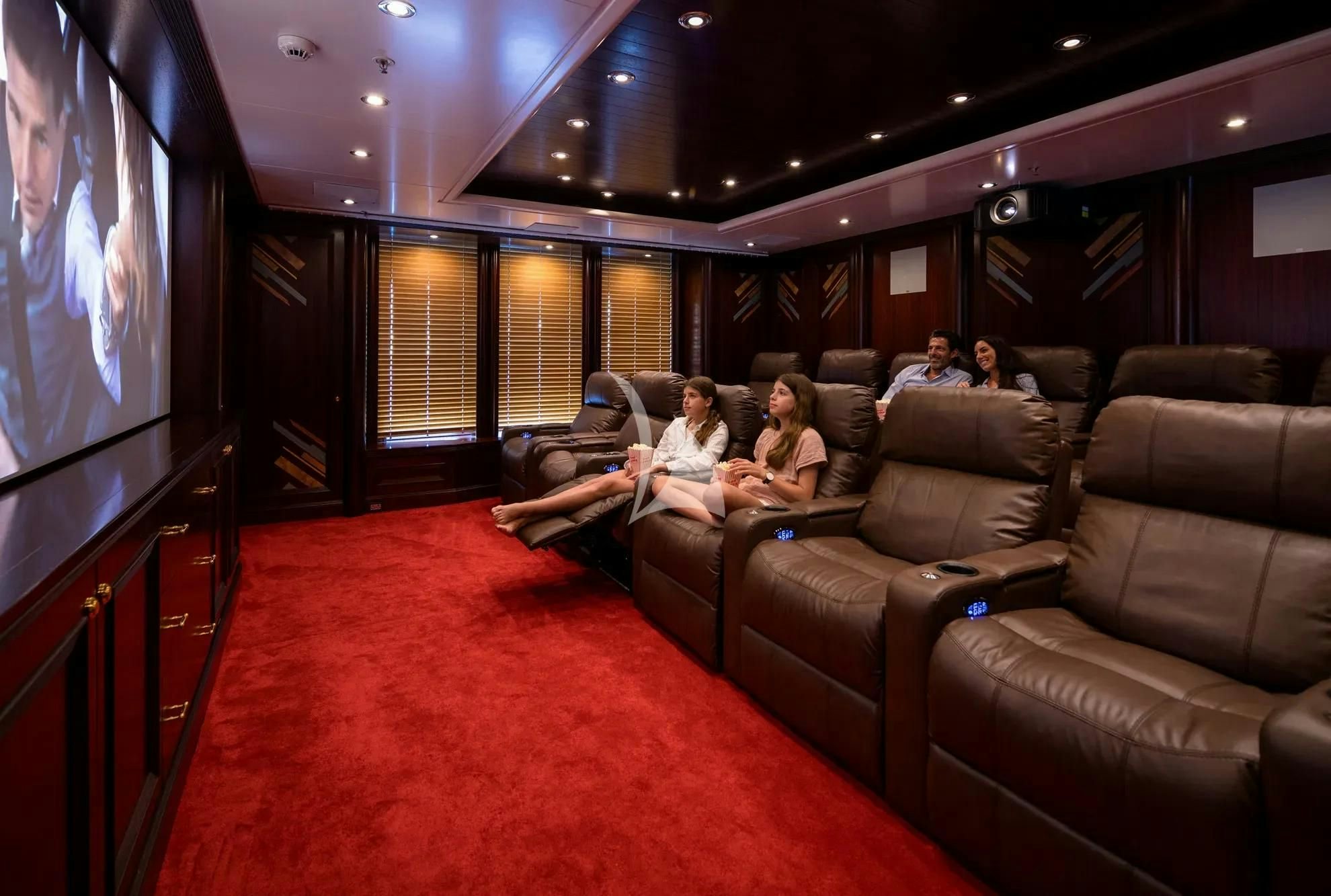 people sitting on couches in a room aboard BOADICEA Yacht for Sale