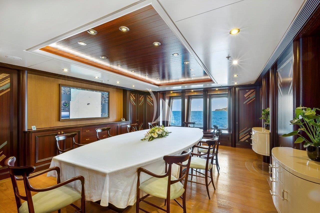 a dining room with a table and chairs aboard BOADICEA Yacht for Sale
