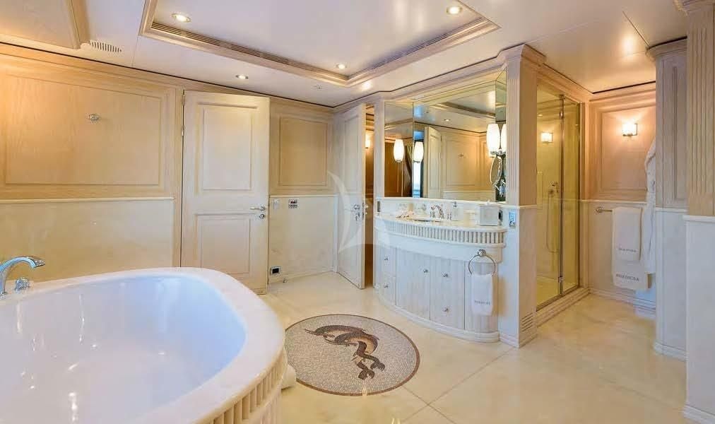 a bathroom with a tub and a sink aboard BOADICEA Yacht for Sale