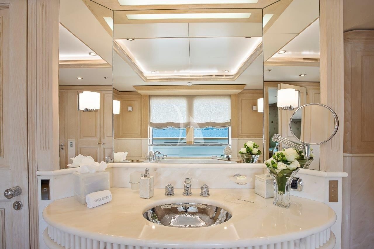 a bathroom with a large mirror aboard BOADICEA Yacht for Sale