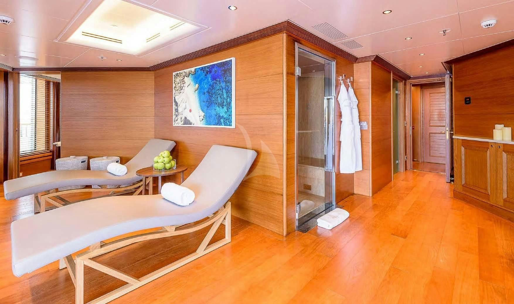 a room with a bed and a couch aboard BOADICEA Yacht for Sale