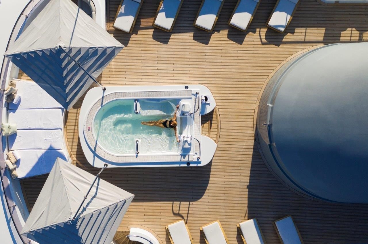 a pool table with umbrellas aboard BOADICEA Yacht for Sale