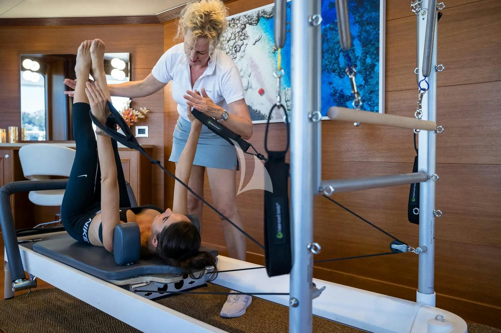 a person and a child in a room with a slide aboard BOADICEA Yacht for Sale