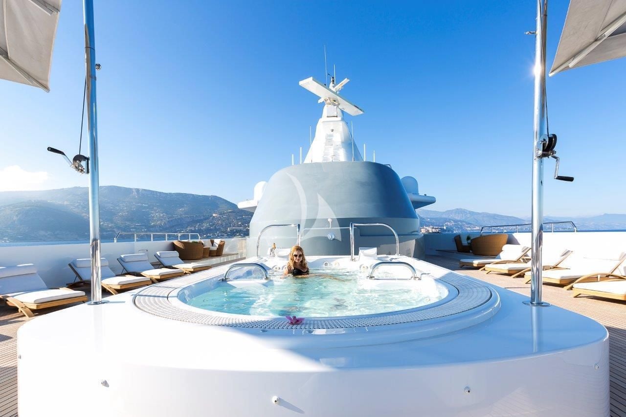 a large white boat with a white sail on it aboard BOADICEA Yacht for Sale