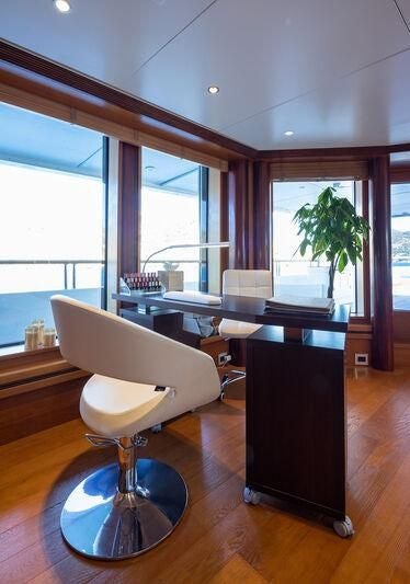 a room with a table and chairs aboard BOADICEA Yacht for Sale