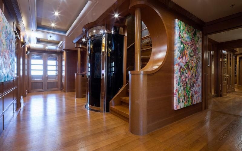 a room with a large fireplace aboard BOADICEA Yacht for Sale