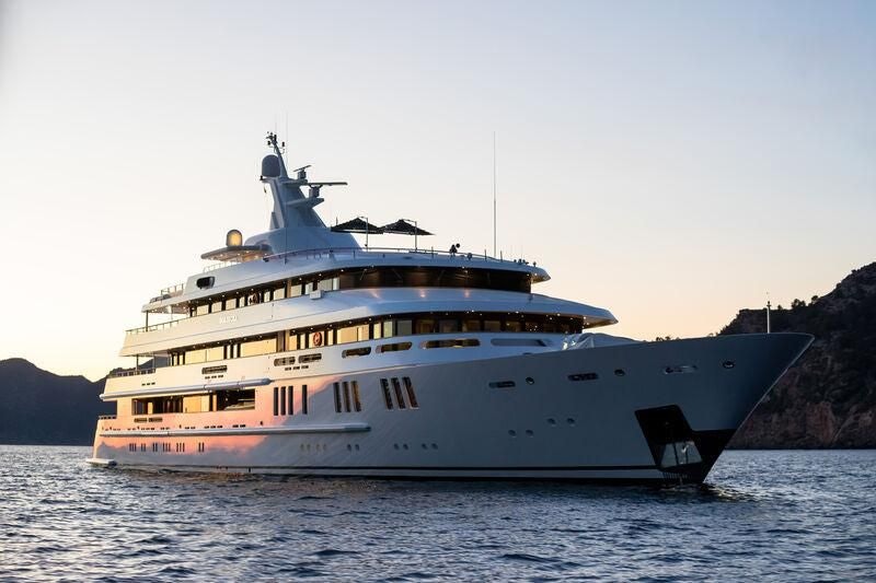 a large ship in the water aboard BOADICEA Yacht for Sale