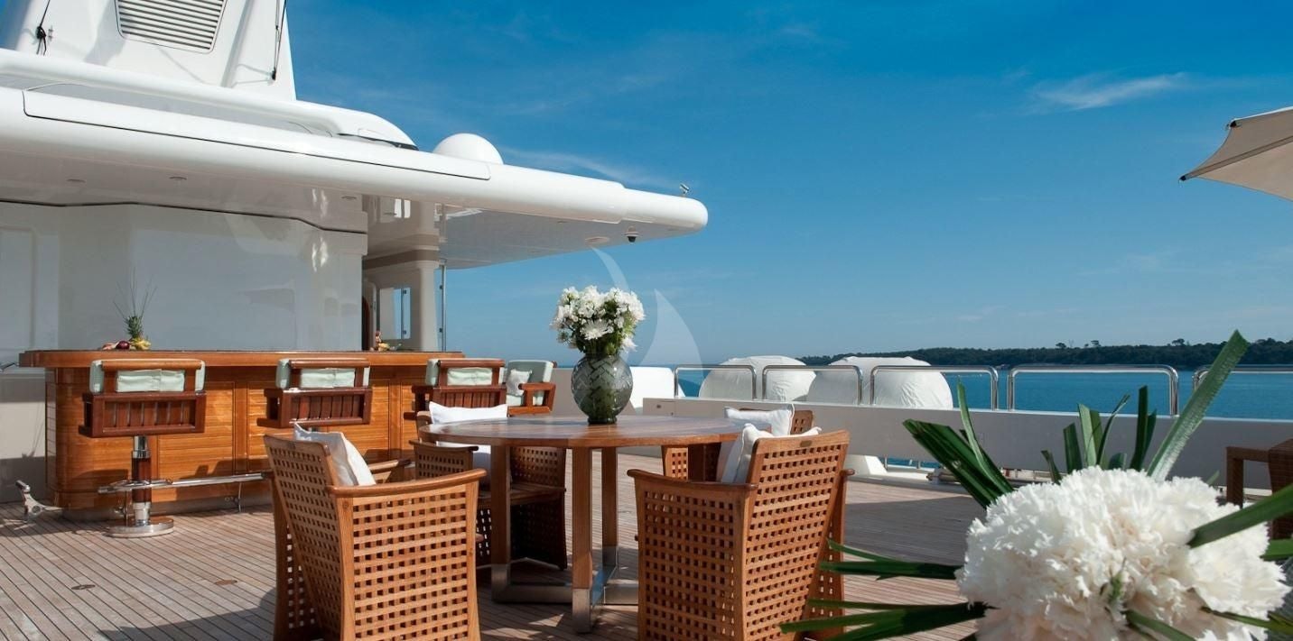 a room with a table and chairs aboard BOADICEA Yacht for Sale