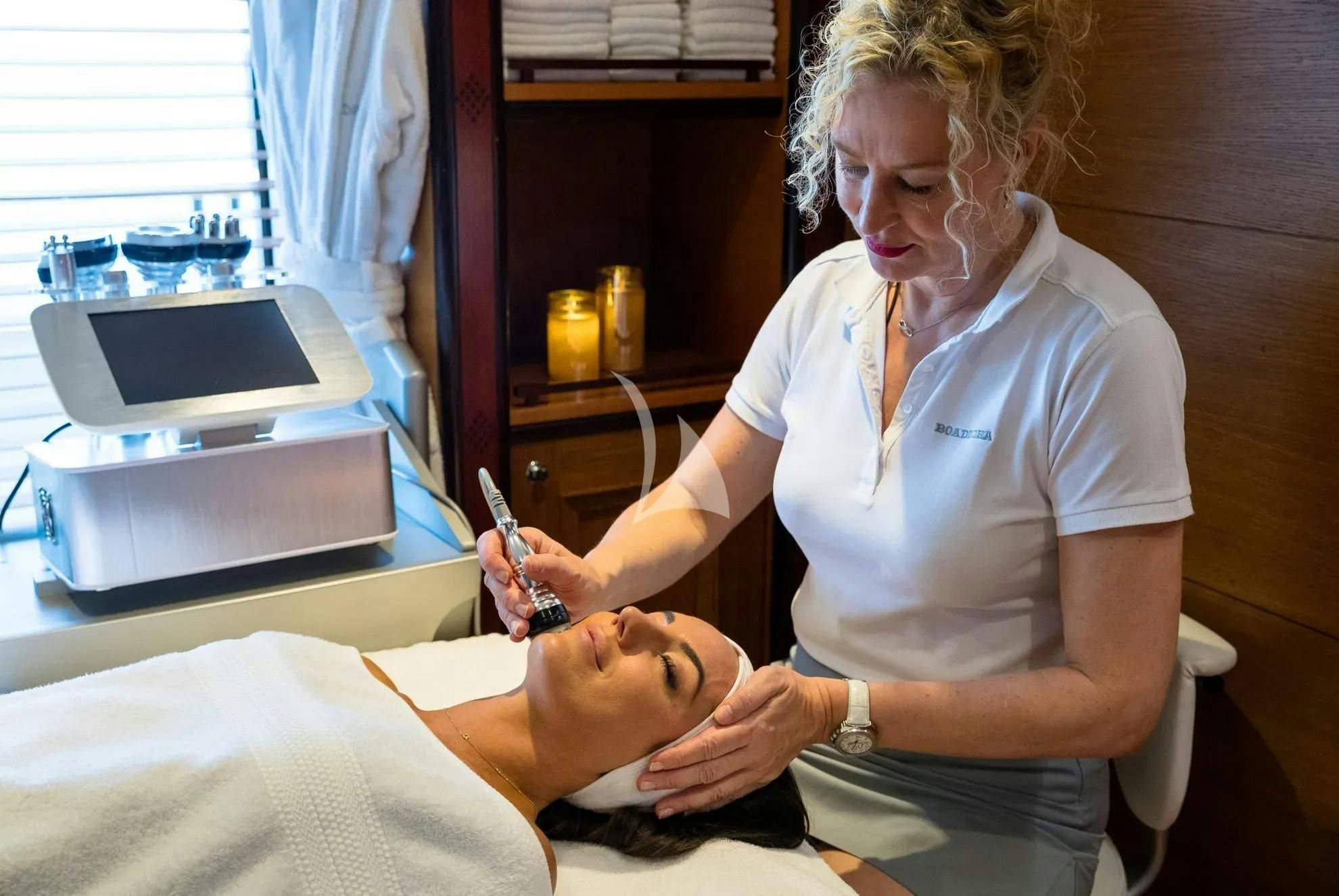 a person in a hospital bed writing on a piece of paper aboard BOADICEA Yacht for Sale