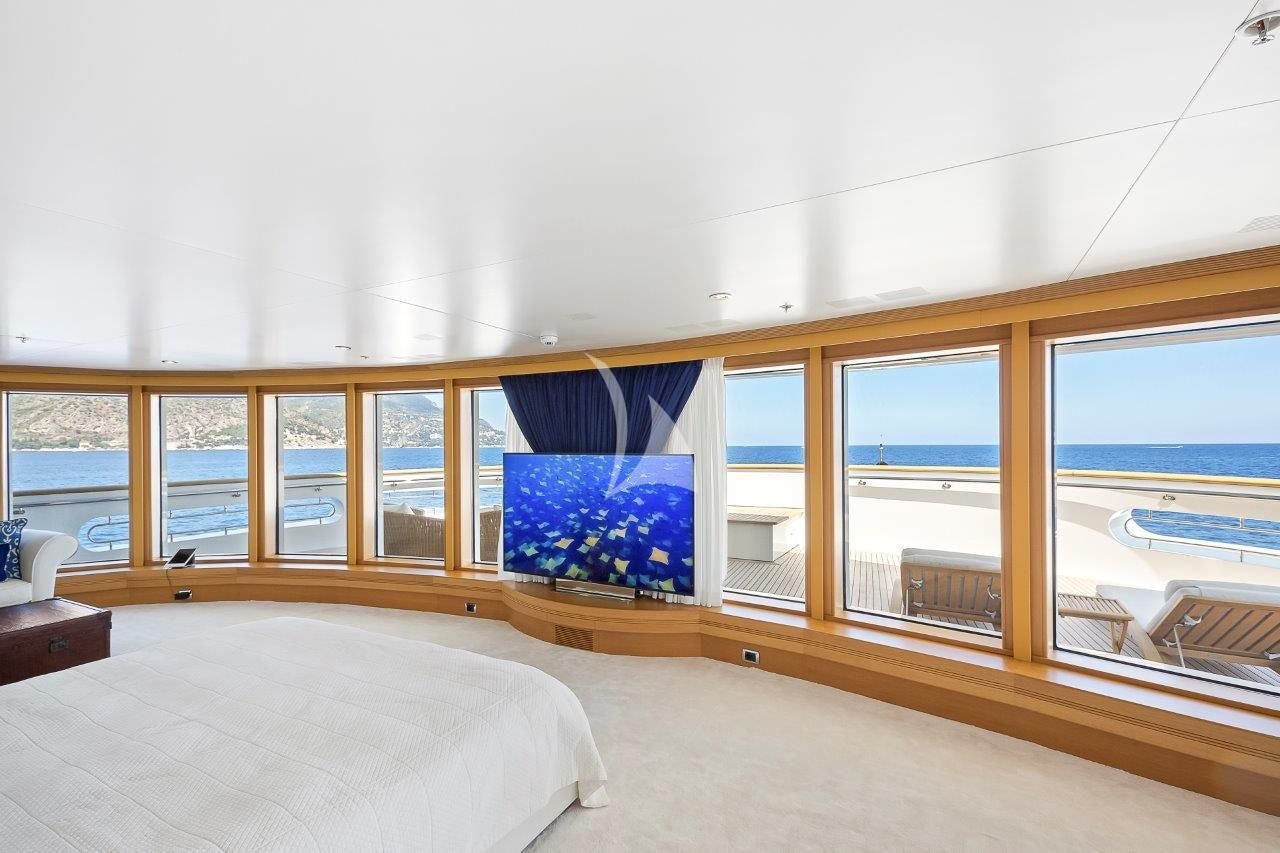 a room with a bed and a window aboard BOADICEA Yacht for Sale