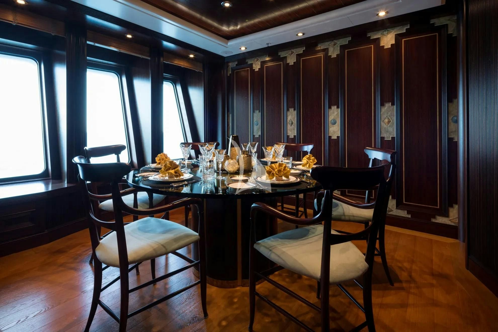 a dining room with a table and chairs aboard BOADICEA Yacht for Sale