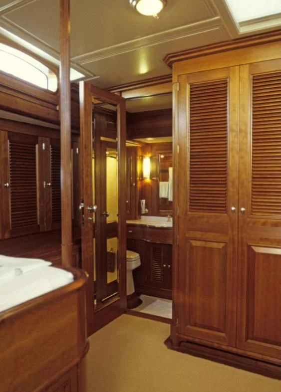 a bathroom with wooden cabinets aboard FOFTEIN Yacht for Sale