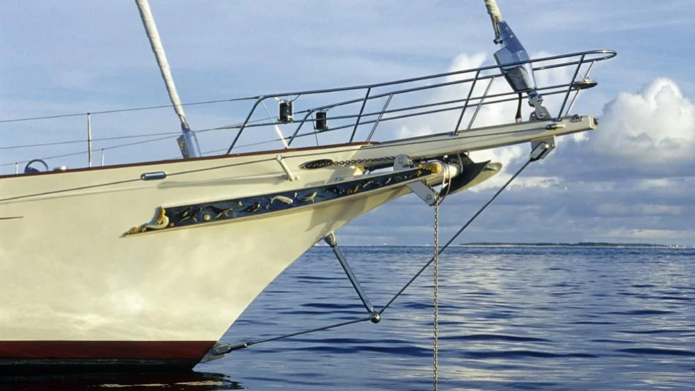 a white and blue boat aboard FOFTEIN Yacht for Sale