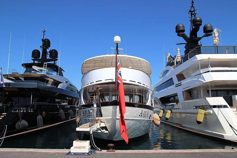 several large boats are parked in a harbor aboard A AND A Yacht for Sale