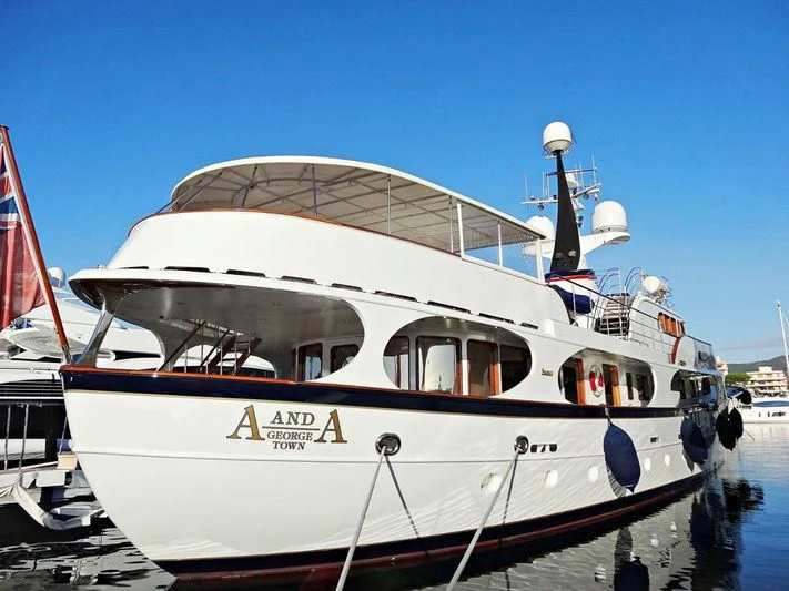 a boat docked at a pier aboard A AND A Yacht for Sale