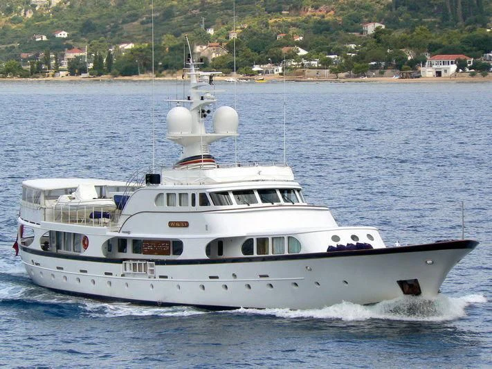 a white boat on the water aboard A AND A Yacht for Sale