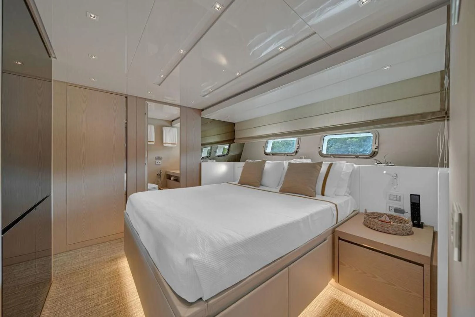 a room with a bed and a desk aboard JUJU Yacht for Sale
