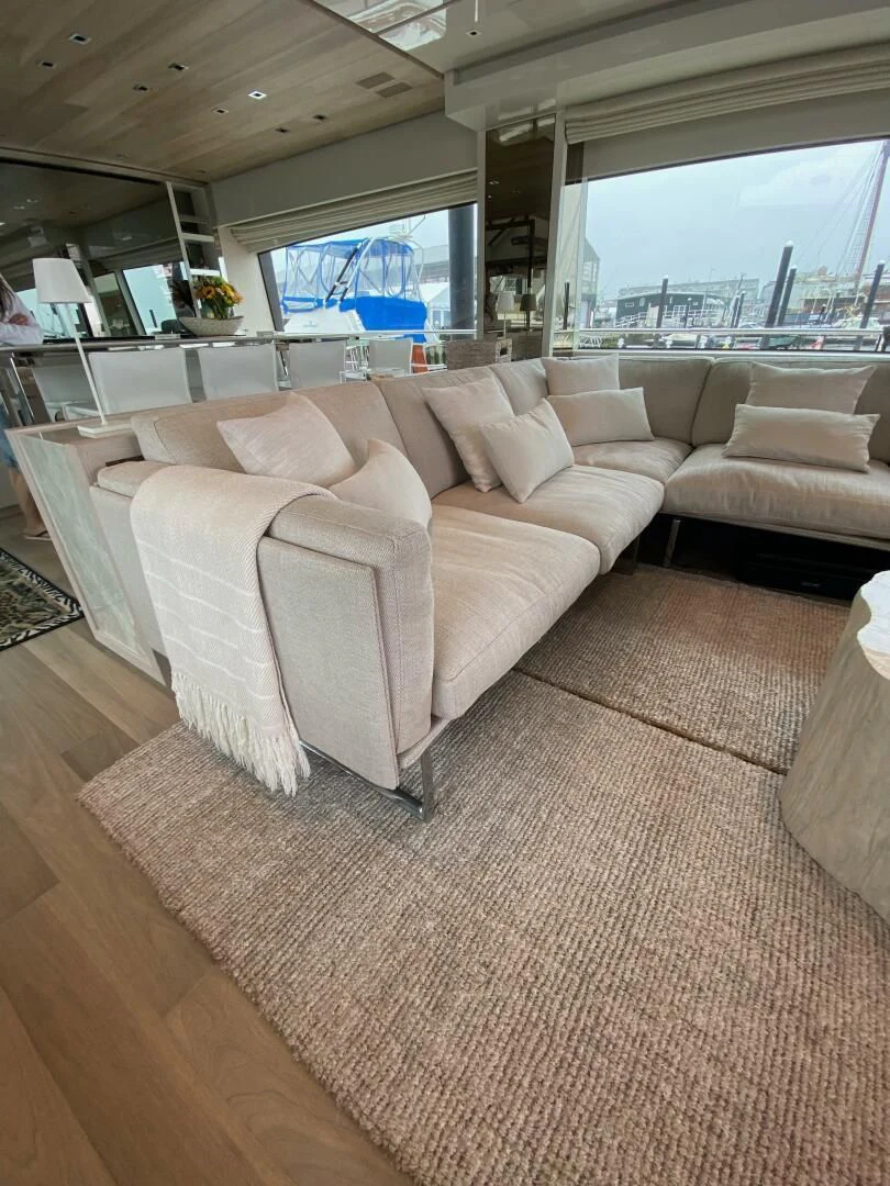 a living room with a large window aboard JUJU Yacht for Sale