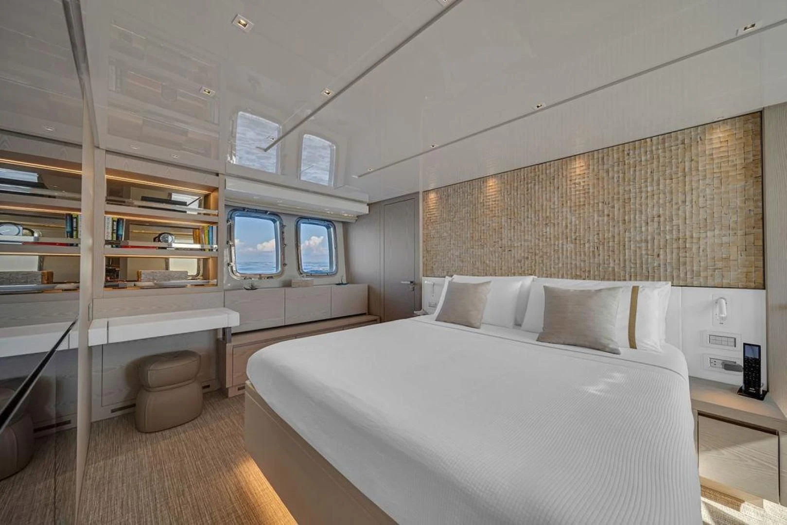 a room with a bed and a window aboard JUJU Yacht for Sale