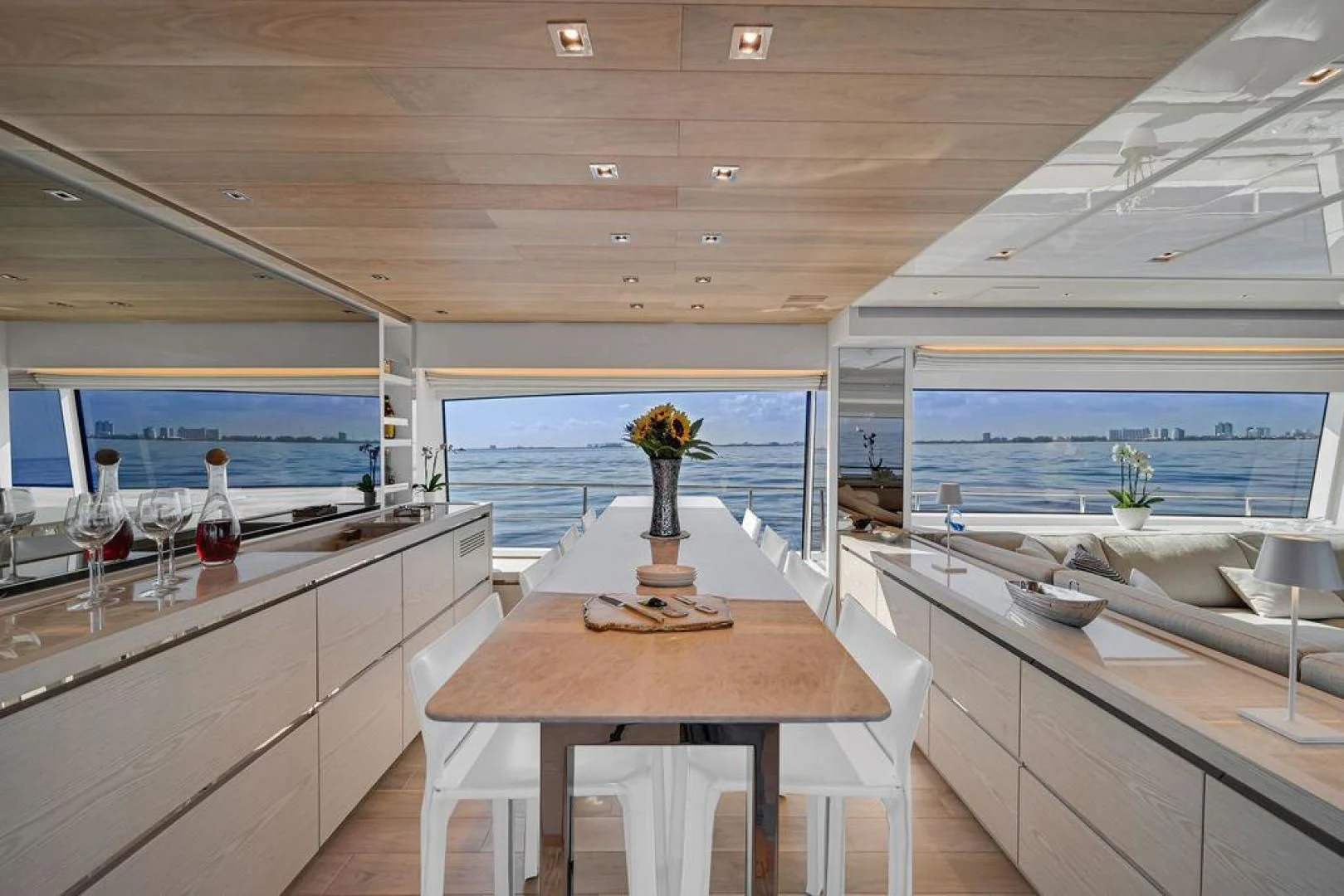 a kitchen with a table and chairs aboard JUJU Yacht for Sale
