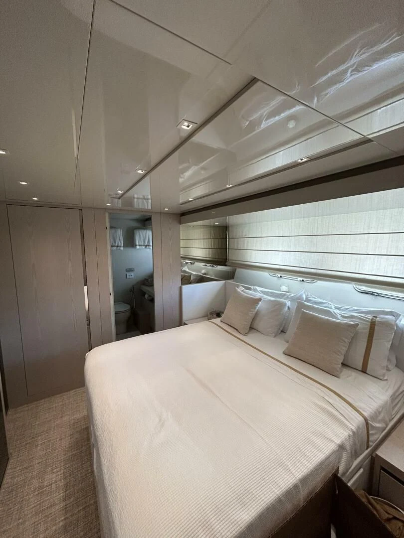a bed in a room aboard JUJU Yacht for Sale