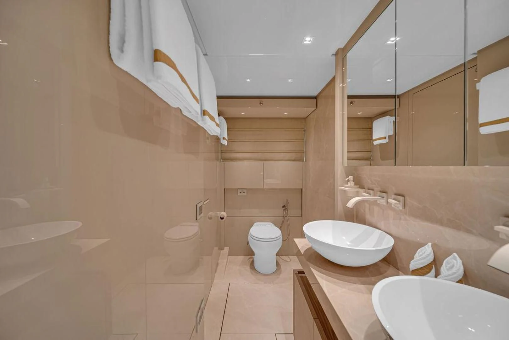 a bathroom with a sink toilet and bathtub aboard JUJU Yacht for Sale