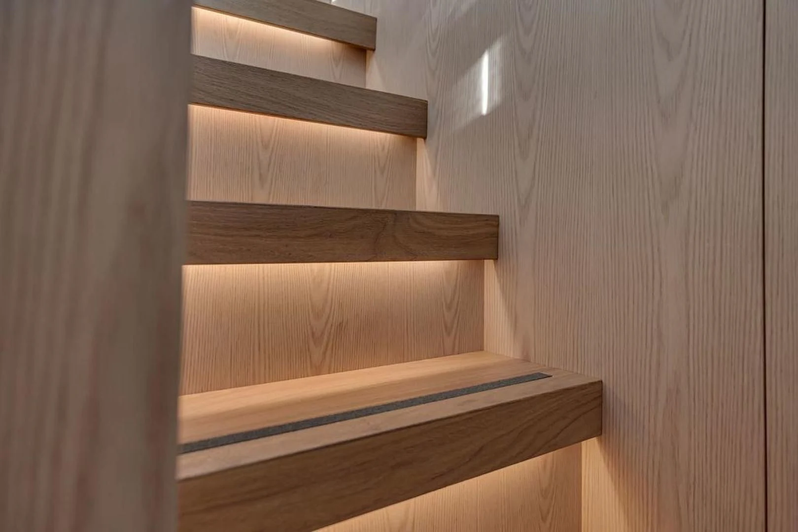 a wooden stair case aboard JUJU Yacht for Sale
