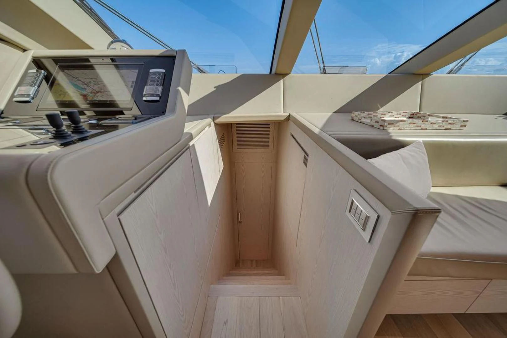 a room with a large window and a view of the water aboard JUJU Yacht for Sale