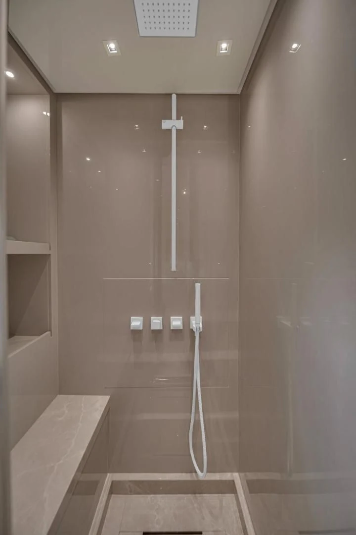 a shower with a glass wall aboard JUJU Yacht for Sale