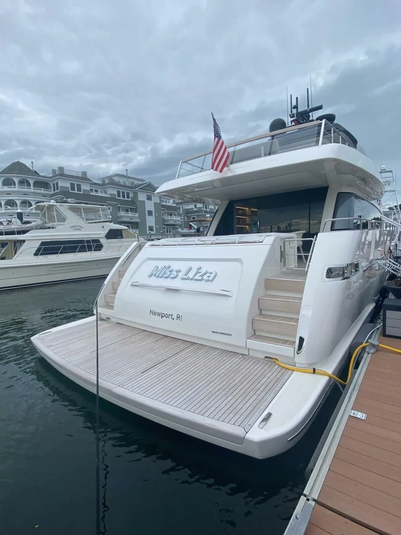 a boat docked at a pier aboard JUJU Yacht for Sale