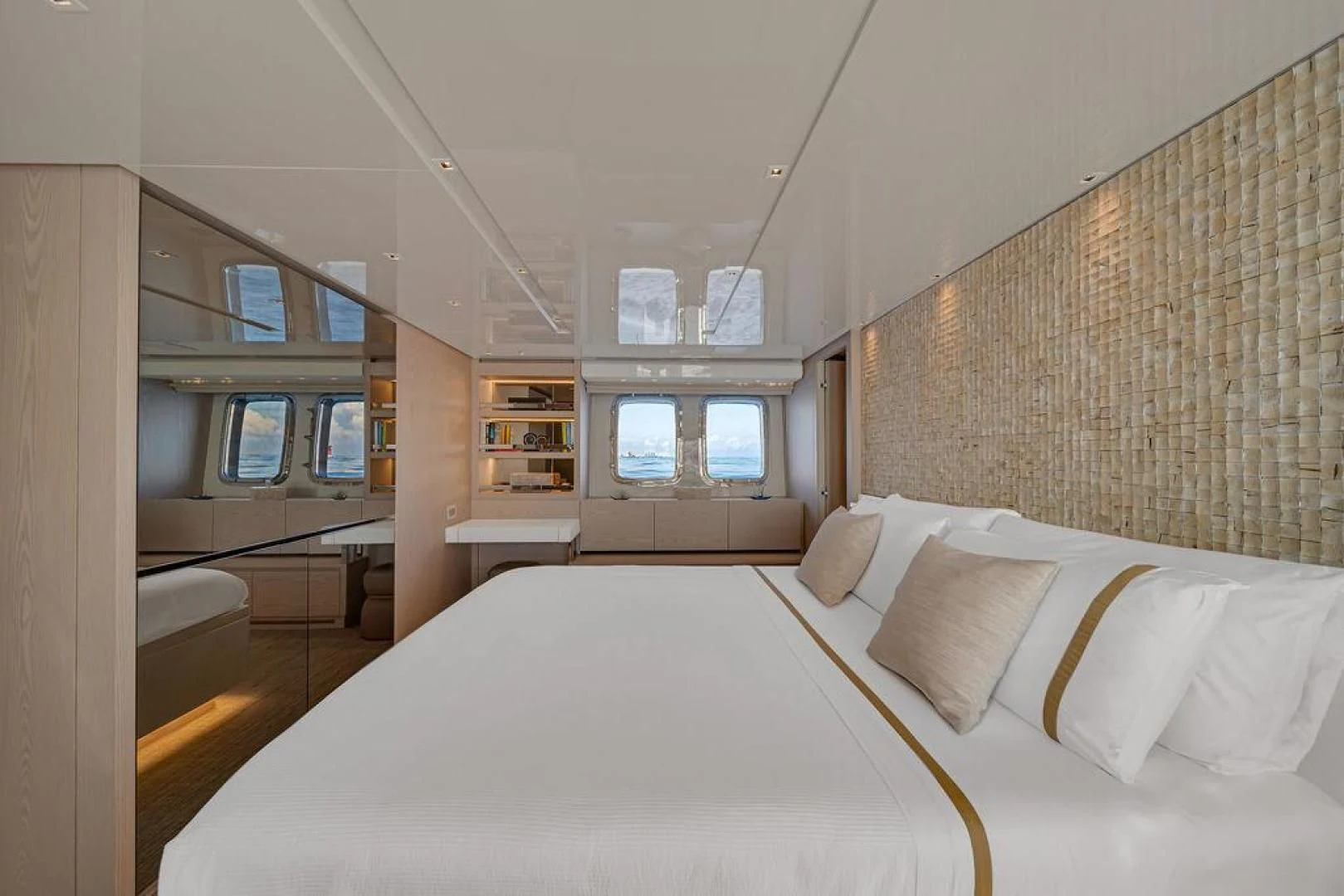 a large bed in a room aboard JUJU Yacht for Sale