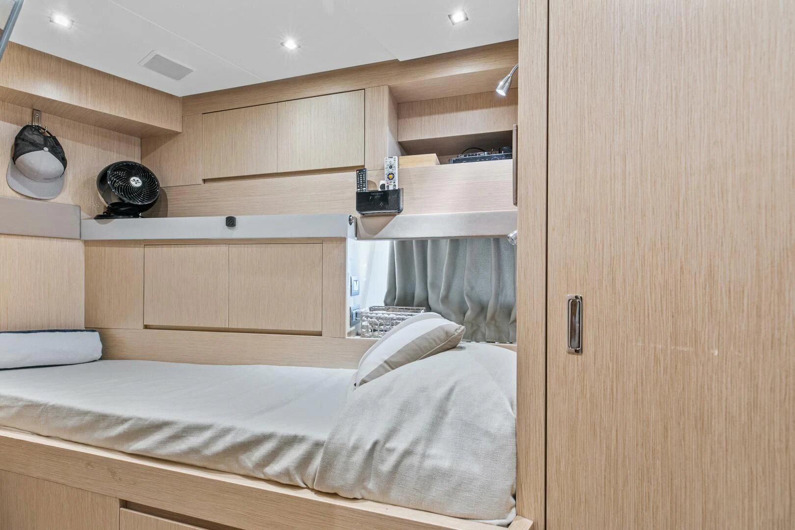 a room with a bed and a shelf aboard JUJU Yacht for Sale